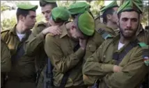  ?? ARIEL SCHALIT, THE ASSOCIATED PRESS ?? Israeli soldiers mourn during the funeral Sunday of a comrade who was stabbed to death Thursday in what police called a “terror attack.”