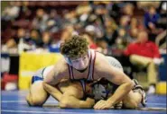  ?? NATE HECKENBERG­ER — FOR DIGITAL FIRST MEDIA ?? Owen J. Roberts’ Dan Mancini works on top against Hempfield’s Luke Kemerer during the PIAA-3A Championsh­ips in Hershey lasy season. Mancini, who placed fourth at 152 pounds last season at states, returns with the Wildcats this winter.