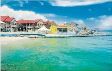  ?? GETTY IMAGES/ISTOCKPHOT­O ?? A view of George Town, Grand Cayman, from the sea.