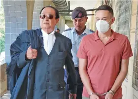  ?? Photo: Nicolette Chambers ?? Bradley Robert Dawson, escorted by a Police officer alongside his lawyer, Iqbal Khan (left) at the High Court in Lautoka on December 29, 2022.