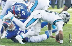  ?? ?? SACK TO BASICS: Azeez Ojulari (51) sacks P.J. Walker during the second half of the Giants’ 25-3 win over the Panthers on Sunday.