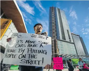  ?? ARLEN REDEKOP/PNG FILES ?? Jason Bang joined Surrey residents protesting a crackdown on secondary suites in the Clayton Heights community.