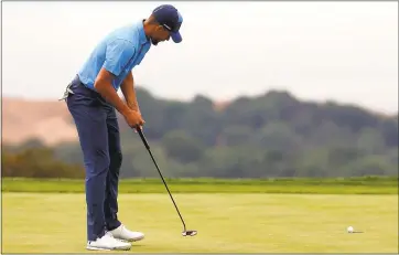  ?? ANDA CHU — STAFF PHOTOGRAPH­ER ?? Curry sinks a par putt on the 18th green to make the turn in 2-over par after his first nine holes in the Ellie Mae Classic. He ended up shooting a 4-over 74.