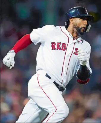  ?? MICHAEL DWYER/AP PHOTO ?? Eduardo Nunez rounds first base on his triple during the seventh inning of Saturday night’s game at Fenway Park in Boston. The Red Sox pounded the Minnesota Twins 10-4.