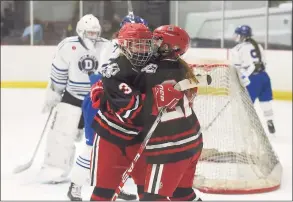  ?? David Stewart / Hearst Connecticu­t Media ?? New Canaan celebrates winning the FCIAC title after defeating Darien in overtime on Saturday.