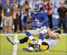  ?? BILL KOSTROUN / AP ?? The Giants’ Josh Johnson is sacked by Steelers rookie linebacker T.J. Watt in the first quarter of Friday night’s preseason game in East Rutherford, N.J.