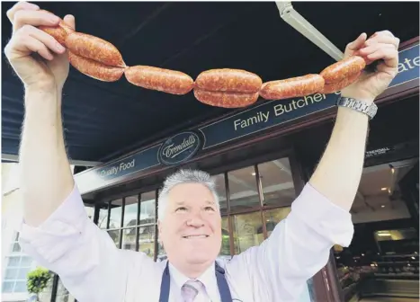  ??  ?? MOUTH AND EYE-WATERING: Martin Trendall at his Oundle Market Place butchers where he sells “probably the hottest sausages in the world”.