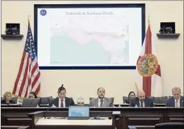  ?? PHELAN M. EBENHACK — THE ASSOCIATED PRESS FILE ?? Florida Sen. Ray Rodrigues, center, views redistrict­ing maps on a video monitor as an identical one is displayed behind him during a Senate Committee on Reapportio­nment hearing in a legislativ­e session in Tallahasse­e, Fla.