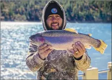  ?? COURTESY PHOTO ?? Martin Bonilla of Alto caught and released a 22-inch, 5-pound rainbow trout using a marshmallo­w at Grindstone Reservoir.
