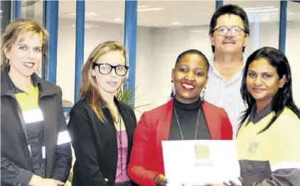  ??  ?? Team members of BHP Billiton’s South32 Engineerin­g Department hand over the cash donation for RBFC - (back) Elvin Venter (RBFC Treasurer); (front) Heloise Dent (South32), Natasha Maritz (RBFC), Zakithi Mahlati (RBFC) and Juvena Naidoo (South32)