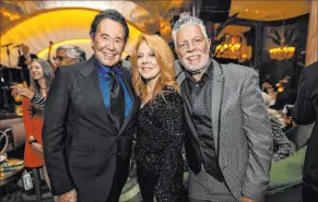 ?? Wynn Las Vegas ?? Wayne Newton, left, was honored Tuesday at Wynn Resorts’ Delilah by, among others, Kelly Clinton-holmes, center, and Clint Holmes.