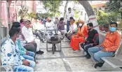  ?? —ANI ?? People listen to PM Modi’s Mann ki Baat in the Gorakhnath Temple in Gorakhpur, Uttar Pradesh on Sunday.