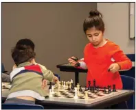  ?? (Arkansas Democrat-Gazette/Cary Jenkins) ?? Siblings Mert and Nur Korkmaz learn the game of life while they play chess during a Tuesday-evening meeting of the CPR Chess Club.