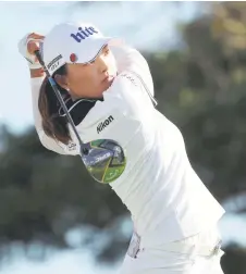  ?? — AFP file photo ?? Ko watches her tee shot.