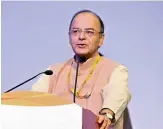  ??  ?? Finance minister Arun Jaitley addressing a seminar on GST during the Vibrant Gujarat Global Summit 2017 in Gandhinaga­r on Wednesday.