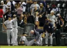  ?? NAM Y. HUH — THE ASSOCIATED PRESS ?? New York Yankees’ Dustin Fowler is checked by a team trainer after an injury during the first inning of the team’s baseball game against the Chicago White Sox on Thursday in Chicago.