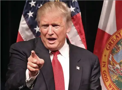  ?? C.M. GUERRERO, TNS ?? Republican presidenti­al candidate Donald Trump greets the small crowd at the Miami Dade College Koubek Center in a town hall style meeting this week in Miami, Fla.