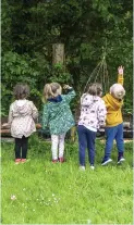  ??  ?? Children from Happy Days Creche seed bomb flower beds last Tuesday