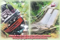  ??  ?? TERBALIK: Keadaan lori yang terbalik selepas jambatan di Kampung Segar, Simunjan runtuh semalam.