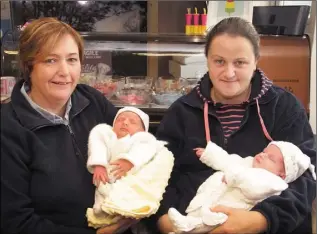  ??  ?? Proprietor of Siopa Linn, Elizabeth Mulligan with her daughter, Cheyrl Mulligan and nine day old twins, Eva and Emma.