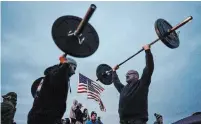  ?? LIBBY MARCH THE NEW YORK TIMES ?? People protest COVID-19 restrictio­ns outside a gym in Orchard Park, N.Y., on Monday. Western New York, a bustling five-county region of some 1.4 million people along the Ontario border, has emerged as the biggest trouble spot of the state's second wave.