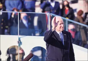  ?? Tasos Katopodis / Associated Press ?? President Joe Biden reacts as he prepares to deliver his inaugural address on the West Front of the U.S. Capitol on Wednesday in Washington.