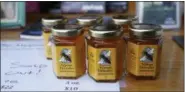  ?? KATHY WILLENS — THE ASSOCIATED PRESS ?? The honey is harvested from hives located inside the 478acre cemetery as part of a program to fight colony collapse disorder among bees, says Green-Wood Manager of Public Engagement and Developmen­t John Connolly.