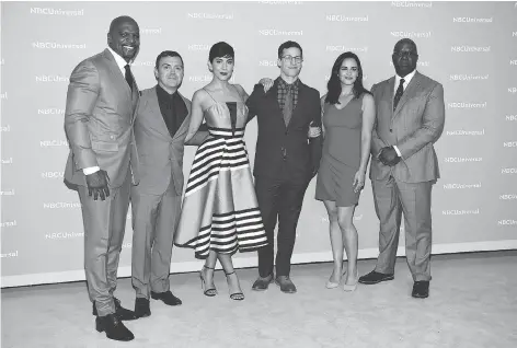  ?? EVAN AGOSTINI/THE ASSOCIATED PRESS ?? Brooklyn Nine-Nine cast members Terry Crews, left, Joe Lo Truglio, Stephanie Beatriz, Andy Samberg, Melissa Fumero and Andre Braugher got good news when their cancelled series was picked up by NBC after fans rallied to save it.