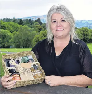  ?? PHOTO: SHAWN MCAVINUE ?? Adapting to change . . . Interior designer Annie SimpsonKin­g, of Dunedin, has been thinking outside the box since losing her job because of the economic impact of Covid19, including launching gift basket business One Seven Two and Simpson King Design.