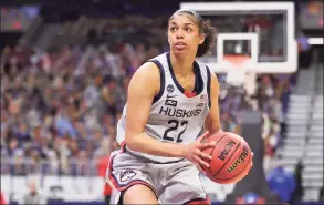  ?? Carmen Mandato / Getty Images ?? UConn’s Evina Westbrook drives to the hoop against Arizona during the third quarter in the Final Four semifinal on Friday in San Antonio. Westbrook will have to decide whether to turn pro or return to UConn for another season.