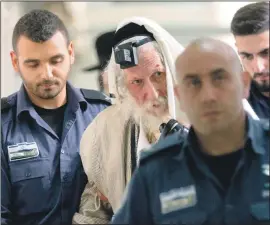  ?? PHOTO: FLASH 90 ?? Eliezer Berland, pictured as he is led into court by police for his 2006 trial