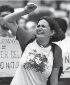  ?? Associated Press file ?? In August 2019 outside Brazil's embassy in Mexico City, 18-year-old Camila La Mont and other environmen­tal activists call for action to protect the Amazon rainforest.