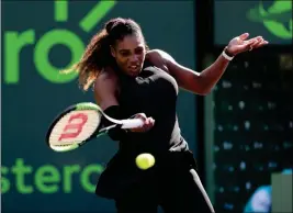  ?? ASSOCIATED PRESS ?? SERENA WILLIAMS RETURNS to Naomi Osaka, of Japan, during the Miami Open tennis tournament Wednesday in Key Biscayne, Fla.