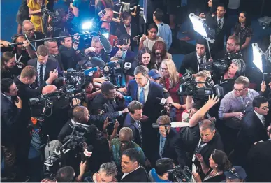  ?? Frederic J. Brown, Getty Images ?? Presidenti­al candidate Beto O’Rourke, center, speaks with the media after a Democratic primary debate Thursday in Houston.