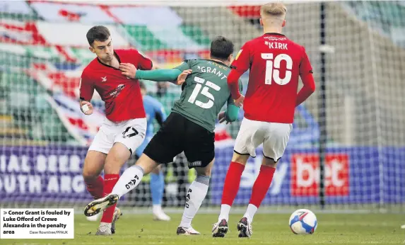  ?? Dave Rowntree/PPAUK ?? Conor Grant is fouled by Luke Offord of Crewe Alexandra in the penalty area