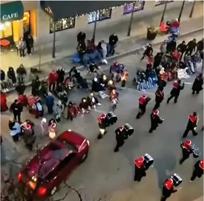  ?? ?? Horror: The car ploughs into marching drummers and onlookers at the rear of the parade