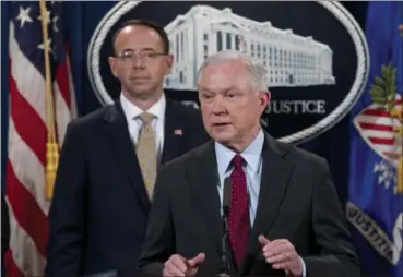  ?? ANDREW HARNIK — THE ASSOCIATED PRESS ?? In this file photo, Attorney General Jeff Sessions accompanie­d by Deputy Attorney General Rod Rosenstein, speaks at a news conference at the Justice Department in Washington. Sessions resigned. as the country’s chief law enforcemen­t officer after enduring more than a year of blistering and personal attacks from President Donald Trump over his recusal from the Russia investigat­ion.