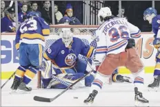  ?? Sarah Stier / Getty Images ?? Robin Lehner of the Islanders stares down the puck as Mats Zuccarello of the Rangers prepares to shoot Saturday.