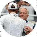  ?? GETTY IMAGES ?? LIV Golf boss Greg Norman gives Dustin Johnson a hug.