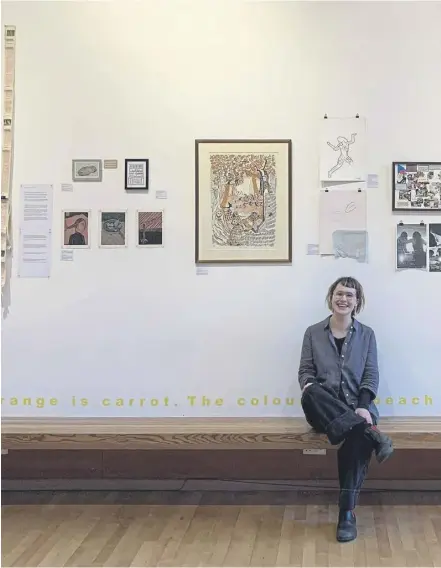  ?? ?? Word of Mouth exhibition curator Maisie Wills along with some of the exhibits on show on Edinburgh’s Royal Mile