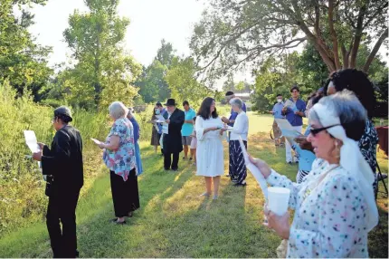  ?? PHOTOS BY SARAH PHIPPS/THE OKLAHOMAN ?? People participat­e in a Tashlich service during “Shofar in the Park” on Tuesday.