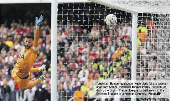  ?? (Photo: AFP) ?? Tottenham Hotspur goalkeeper Hugo Lloris fails to save a shot from Arsenal midfielder Thomas Partey (not pictured) during the English Premier League football match at the Emirates Stadium in London on Saturday.