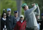  ?? CHRIS CARLSON — THE ASSOCIATED PRESS ?? Charley Hoffman hits a drive on the 18th hole during the first round of the Masters golf tournament Thursday in Augusta, Ga. Hoffman shot a 7-under 65 to take a fourshot lead.