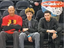  ?? Howard Simmons / New York Daily News ?? LaVar Ball (left) has a strange plan for sons LaMelo (center) and LiAngelo: profession­al deals to play in Lithuania.