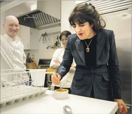  ?? Richard Drew Associated Press ?? GOURMET editor Ruth Reichl samples a f lan by Ian Knauer and Kay Chun in April 2009. The magazine would fold by year’s end.