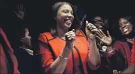  ?? Andres Kudacki Associated Press ?? LETITIA JAMES celebrates her election as attorney general of New York on Tuesday. She will become the first woman and first black person in the office.