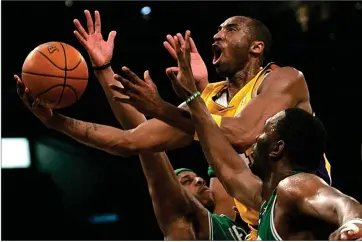  ?? AP PHOTO BY BRANIMIR KVARTUC ?? In this Feb. 23, 2007, file photo, Los Angeles Lakers’ Kobe Bryant, top, goes up for a shot between Boston Celtics’ Paul Pierce, left, and Al Jefferson during the first half of an NBA basketball game in Los Angeles. Kobe Bryant, Tim Duncan and Kevin Garnett are all expected to be officially announced as members of the 2020 enshrineme­nt class for the Basketball Hall of Fame on Saturday, April 4.