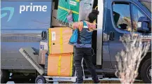  ?? David Zalubowski/Associated Press ?? An Amazon Prime delivery person lifts packages last year in Denver. Amazon delivered packages to its Prime customers at the fastest speeds ever in 2023, the retailer said Tuesday.