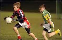  ??  ?? Liam Byrne (Ferns) is chased by Bunclody’s Tadhg Byrne.