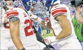  ?? ?? BARK’ & BITE: Saquon Barkley celebrates his first-quarter touchdown with backup running back Matt Breida during the Giants’ 31-24 win on Sunday.